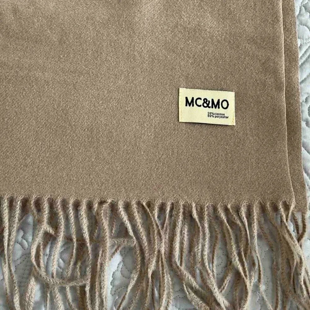 Brown Soft warm scarf is a mixture of polyester and viscose condition is new
